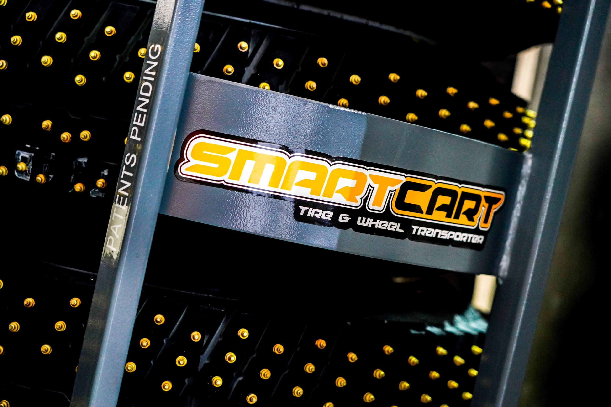 Close-up of Smart Cart Tire and Wheel Transporter logo with Patents Pending text on frame