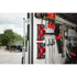 Milwaukee M18 Dual Bay Super Chargers mounted vertically in a work van or trailer for on-the-go charging