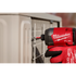 Milwaukee M18 FUEL impact driver with SHOCKWAVE bit driving a screw into a cabinet panel