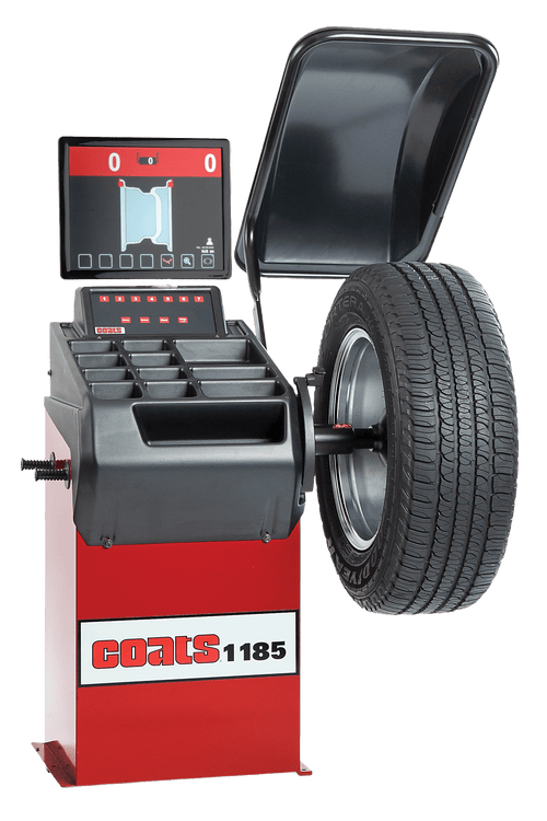Coats 1185 Wheel Balancer quarter view with tire mounted on spindle