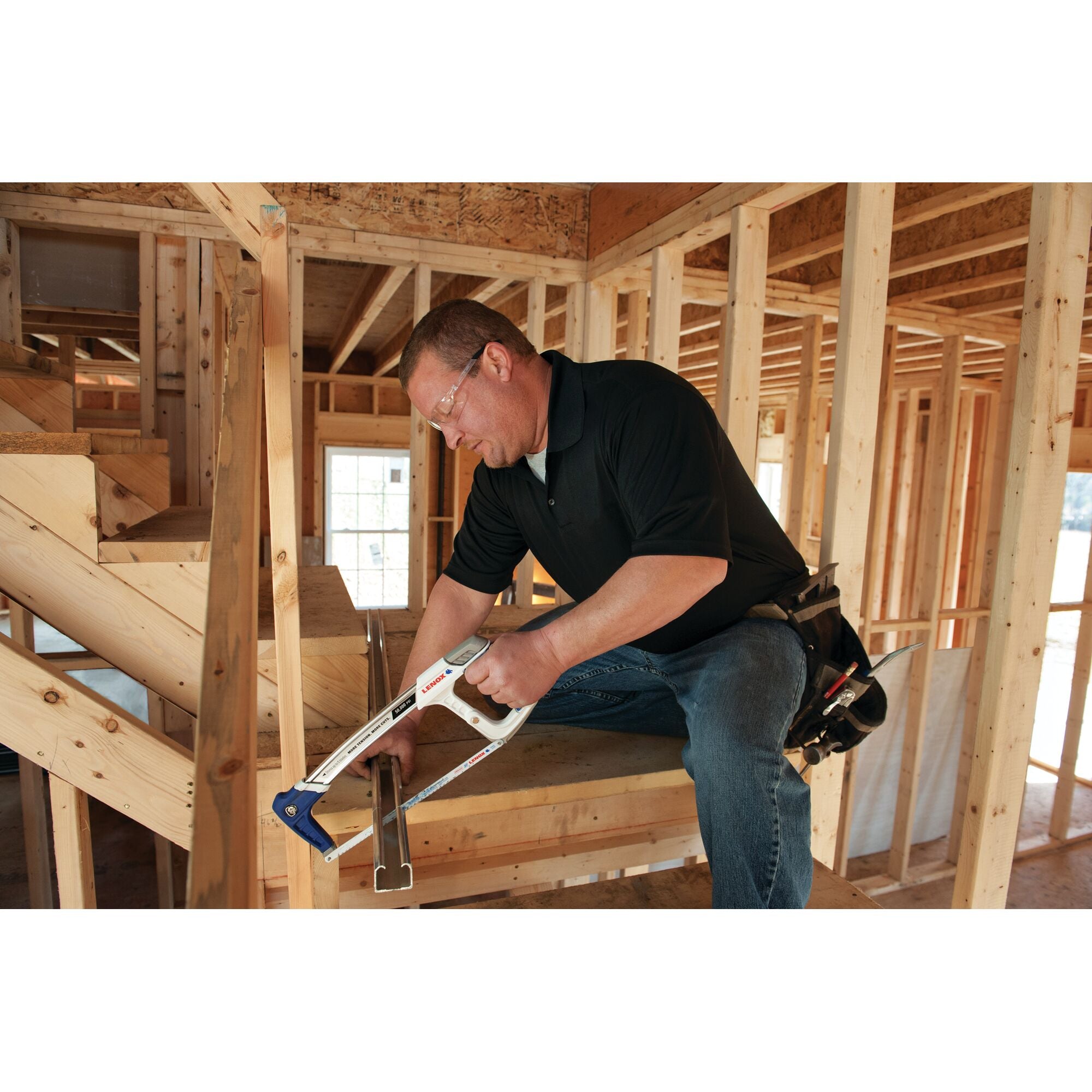 Lenox Tools High Tension Hacksaw in use on interior construction framing