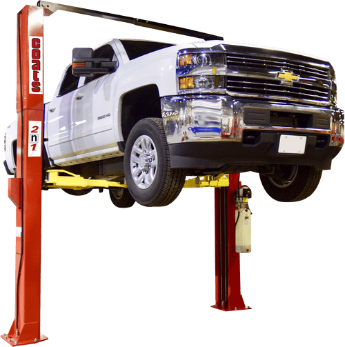 Coats 4T212SSR1 12,000 lb symmetrical 2-post vehicle lift raising a white Chevy 3500 HD truck