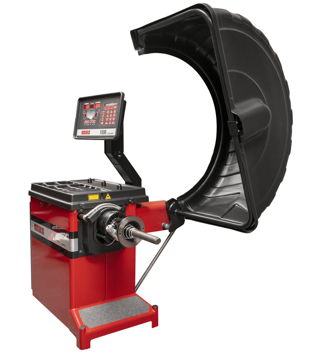 Coats 1500 Direct Drive Wheel Balancer side view showing open tire guard and spindle assembly
