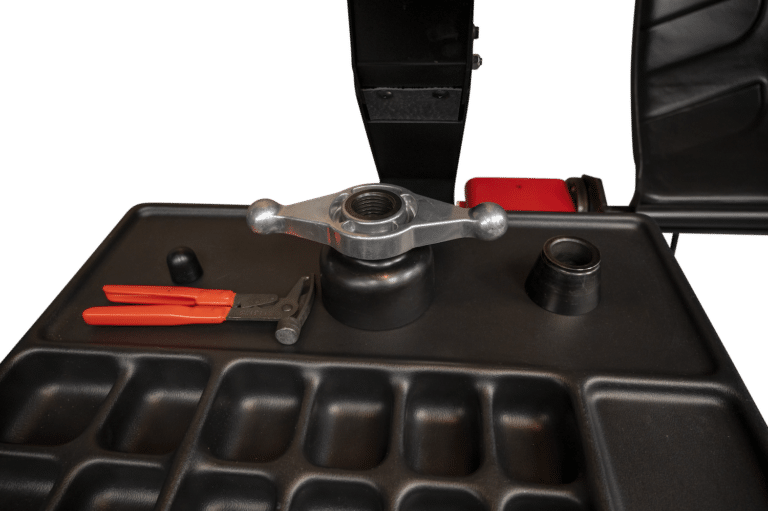 Coats 1500 Wheel Balancer top tray with mounted accessories including wing nut and weight pliers
