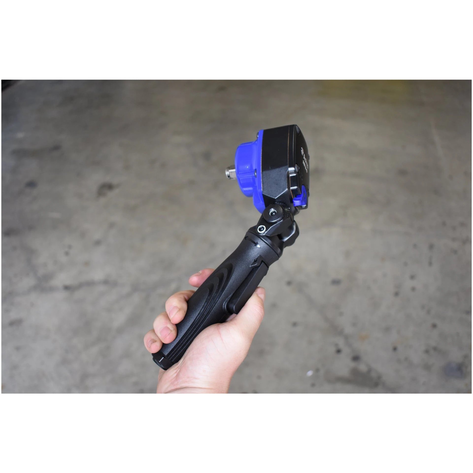 Astro Pneumatic 1834 1/2 In Nano Flex-Head Angle Impact Wrench held in hand showing compact size