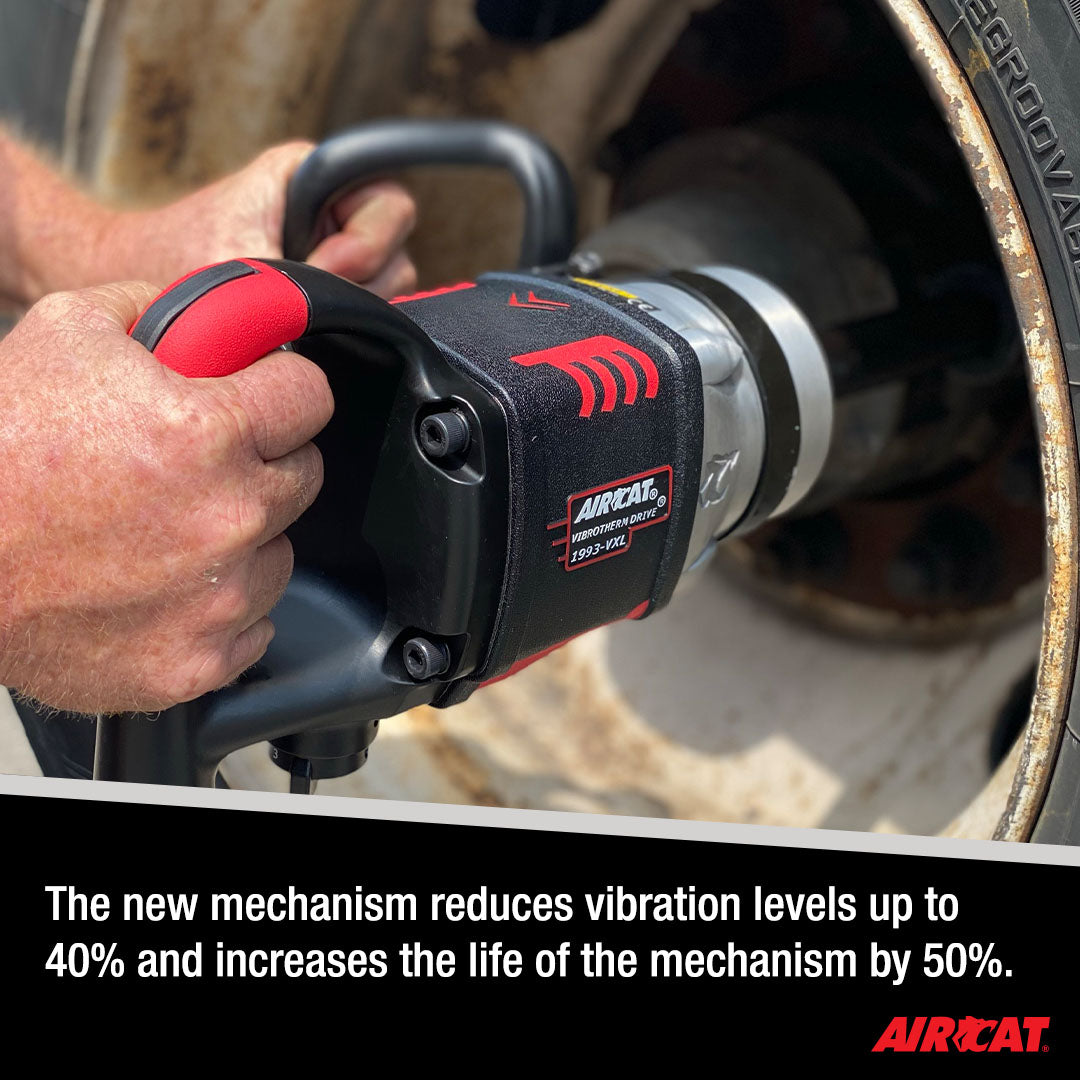 Aircat 1993-VXL Impact Wrench in use on a heavy-duty wheel hub, highlighting vibration reduction up to 40% and 50% longer mechanism life