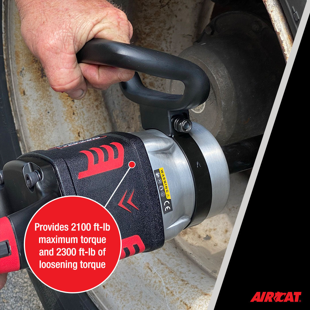 Aircat 1993-VXL Impact Wrench in use on a truck wheel, callout showing 2100 ft-lb maximum torque and 2300 ft-lb loosening torque