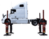 Side view of Coats 19K Mobile Column Lift with semi truck raised on four columns