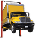 Coats 4T216SSR1 16,000 lb two-post lift raising a yellow box truck, front view