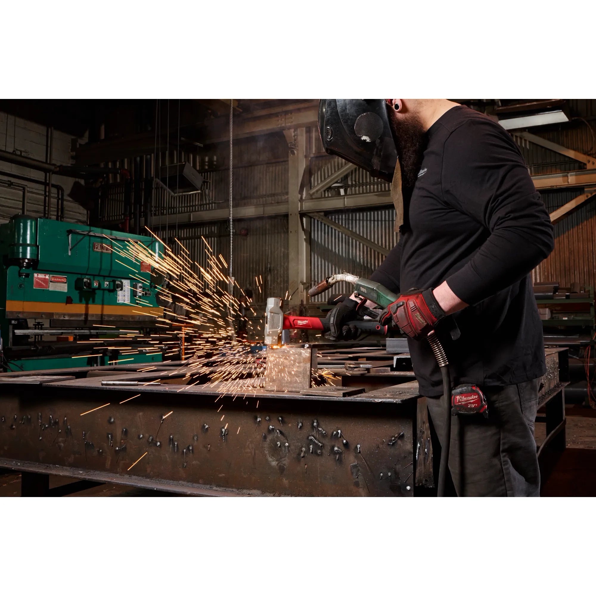 Milwaukee Tool professional using Milwaukee tool in industrial workshop setting