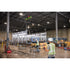 Workers using Milwaukee M18 Chain Hoist with wireless remote to hoist large prefabricated wall section in warehouse