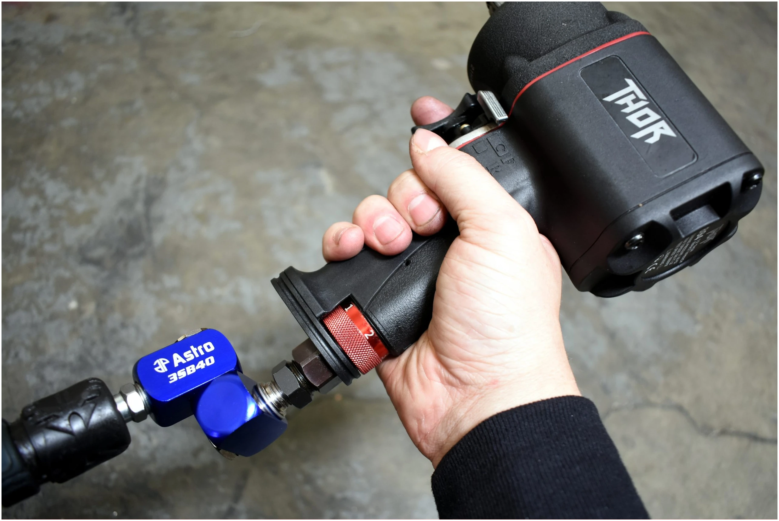 Astro Pneumatic 3SB40 High Flow 3-Way Air Swivel connected to Astro THOR impact wrench - in-use lifestyle photo