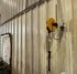 Alert Stamping 5050CL8 ProReel retractable cord reel wall-mounted in an indoor workshop
