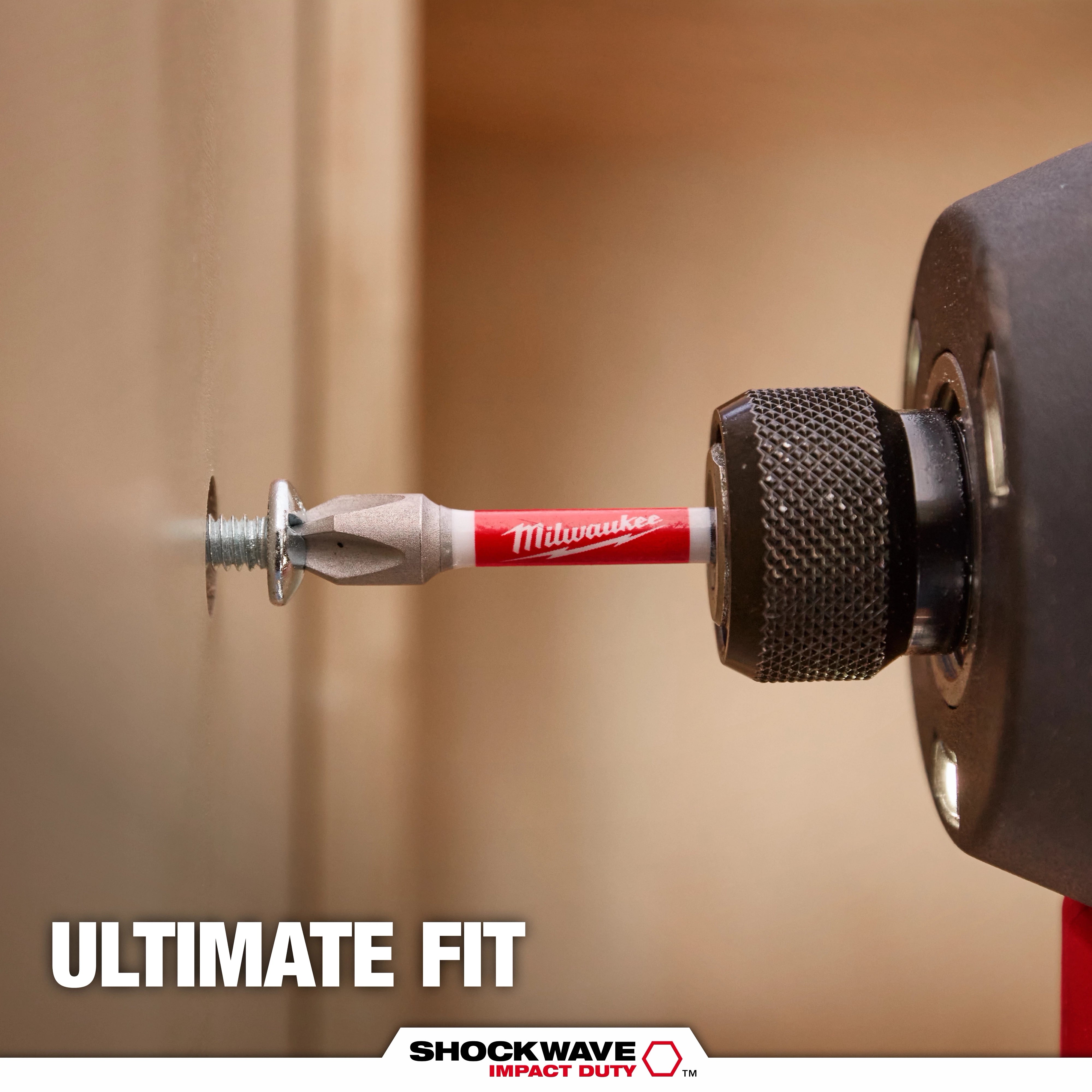 Milwaukee SHOCKWAVE Impact Duty bit driving a screw into wood - Ultimate Fit lifestyle photo