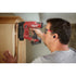 Worker on jobsite wearing Milwaukee REDLITHIUM USB Bluetooth Jobsite Earbuds with foam ear tips