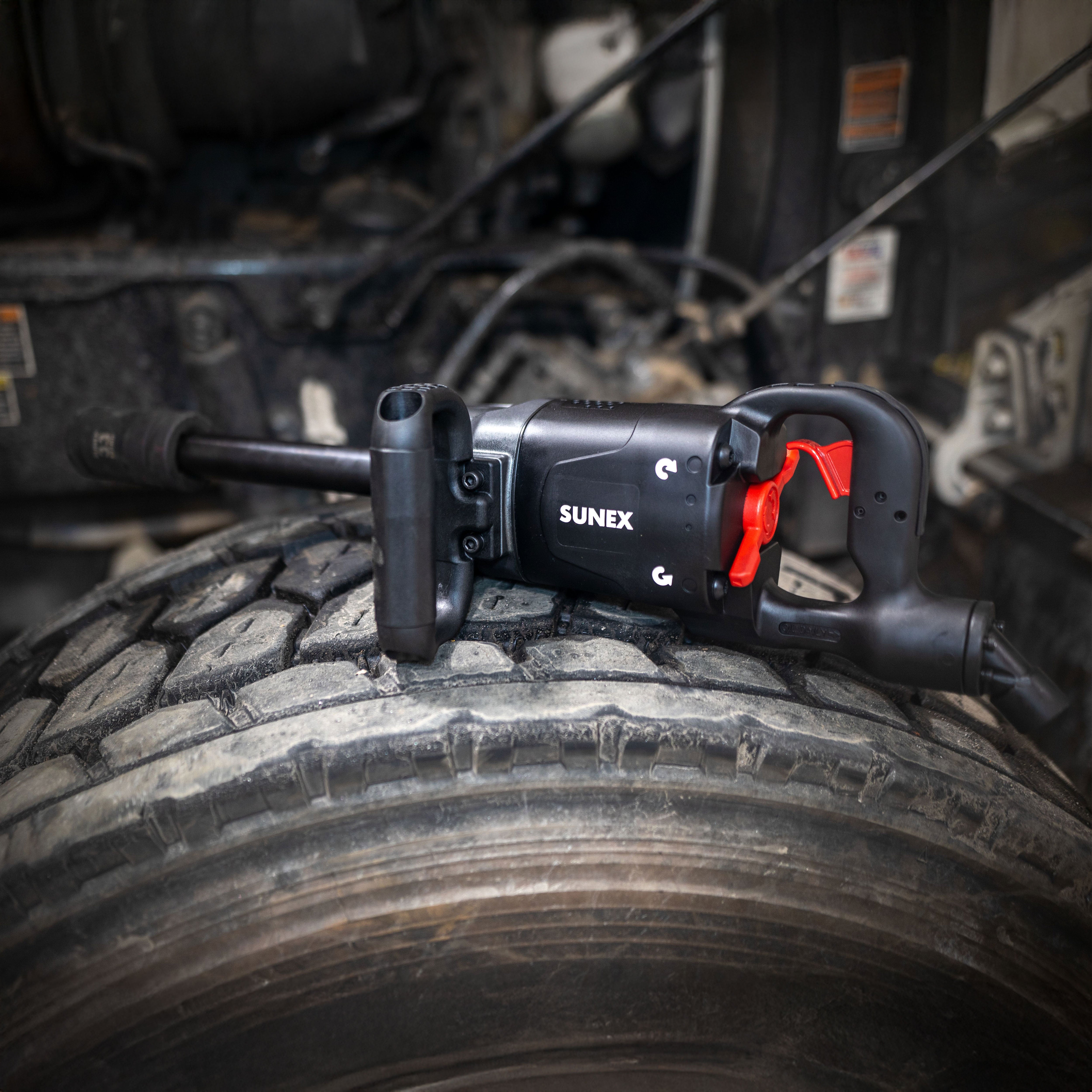 Sunex Tools SX01026 1" Drive Impact Wrench with 6" Extended Anvil resting on truck tire