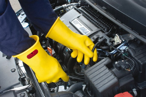 Ansell RIG011Y100 Yellow Rubber Class 0 Lineman's Gloves X-Large worn while working on a vehicle engine