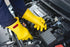 Ansell RIG011Y100 Yellow Rubber Class 0 Lineman's Gloves X-Large worn while working on a vehicle engine