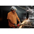 Worker grinding metal on jobsite while wearing Milwaukee Tool 2118-21 BOLT REDLITHIUM USB Headlamp on hard hat with face shield