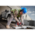 Worker wearing Milwaukee BOLT 26dB Earmuffs on safety helmet while operating circular saw on jobsite