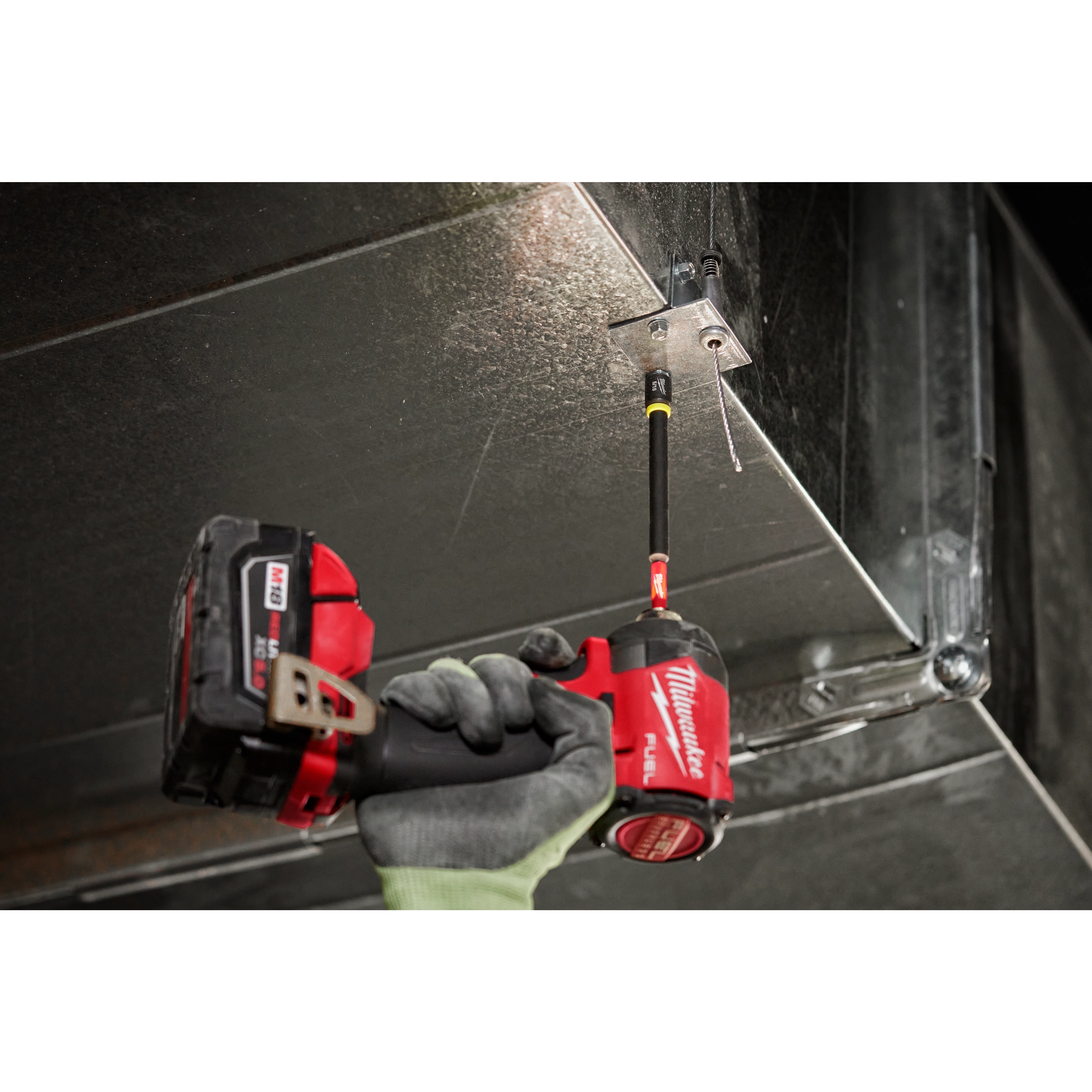 Milwaukee SHOCKWAVE 5/16" x 6" Magnetic Nut Driver in use on sheet metal with M18 FUEL impact driver