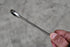 Close-up of Astro Pneumatic Razor super-thin ratcheting wrench being held showing slim profile