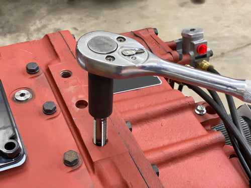 Lisle 71670 Large Tap Socket in use with ratchet on engine block in restricted area