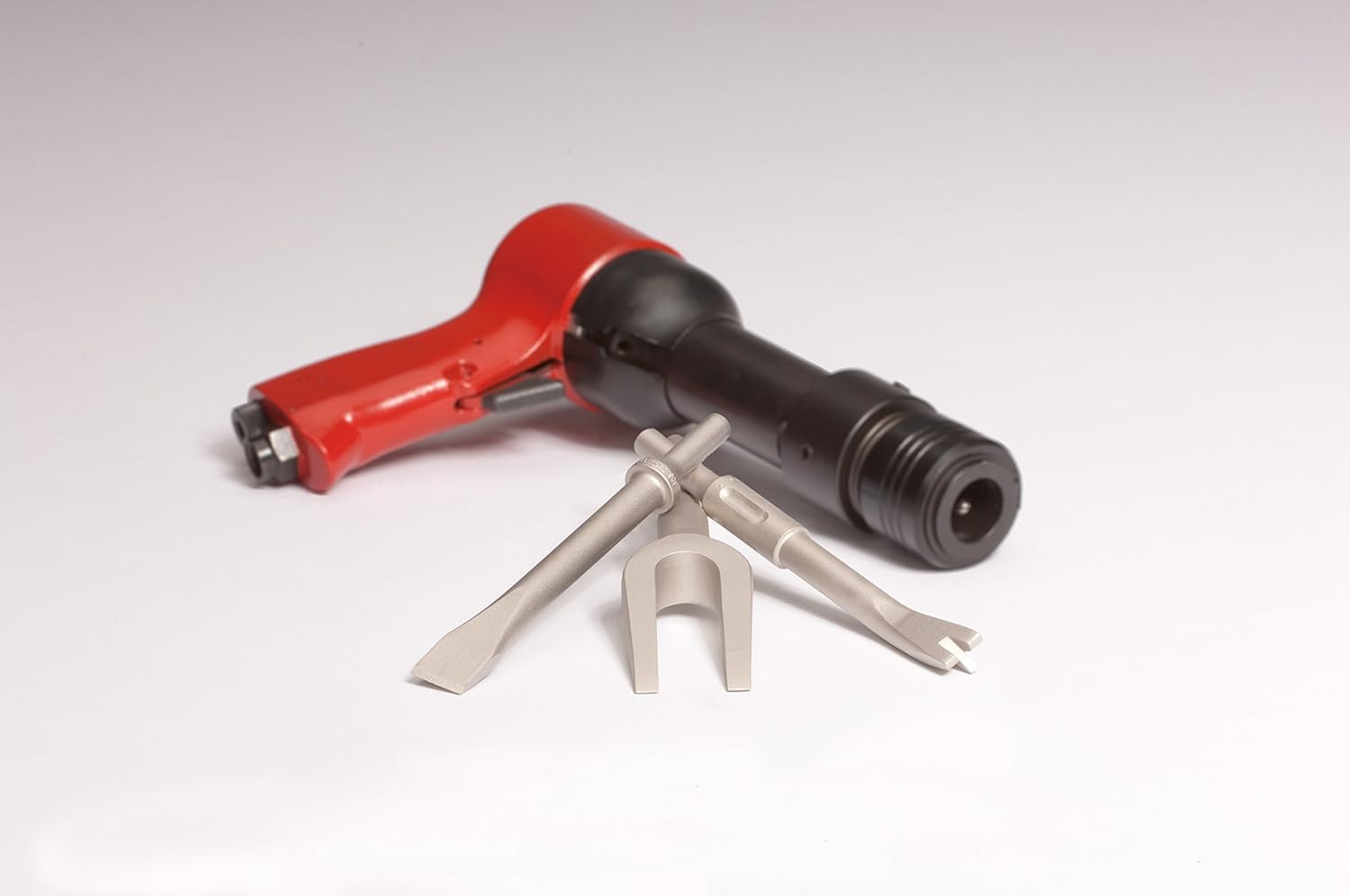 Ajax Tool Works A897-IR .401 Mech Aid Retaining Spring shown with air hammer and chisel bits
