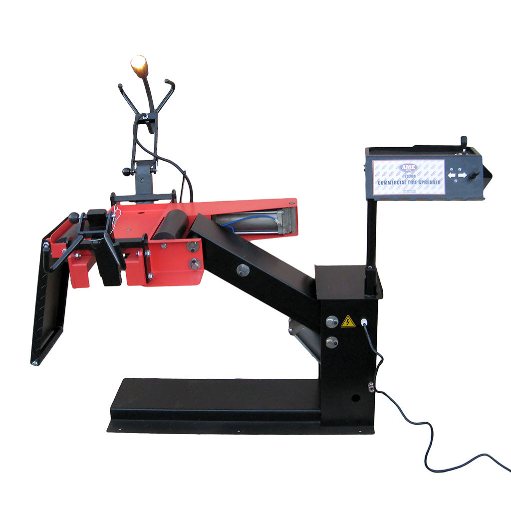 AME International 73200 Automatic Truck Tire Spreader front view showing spreading arms and roll-on ramp