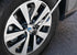 Titan Tools 12109 Ratcheting Breaker Bar Adapter in use on a vehicle wheel hub with breaker bar