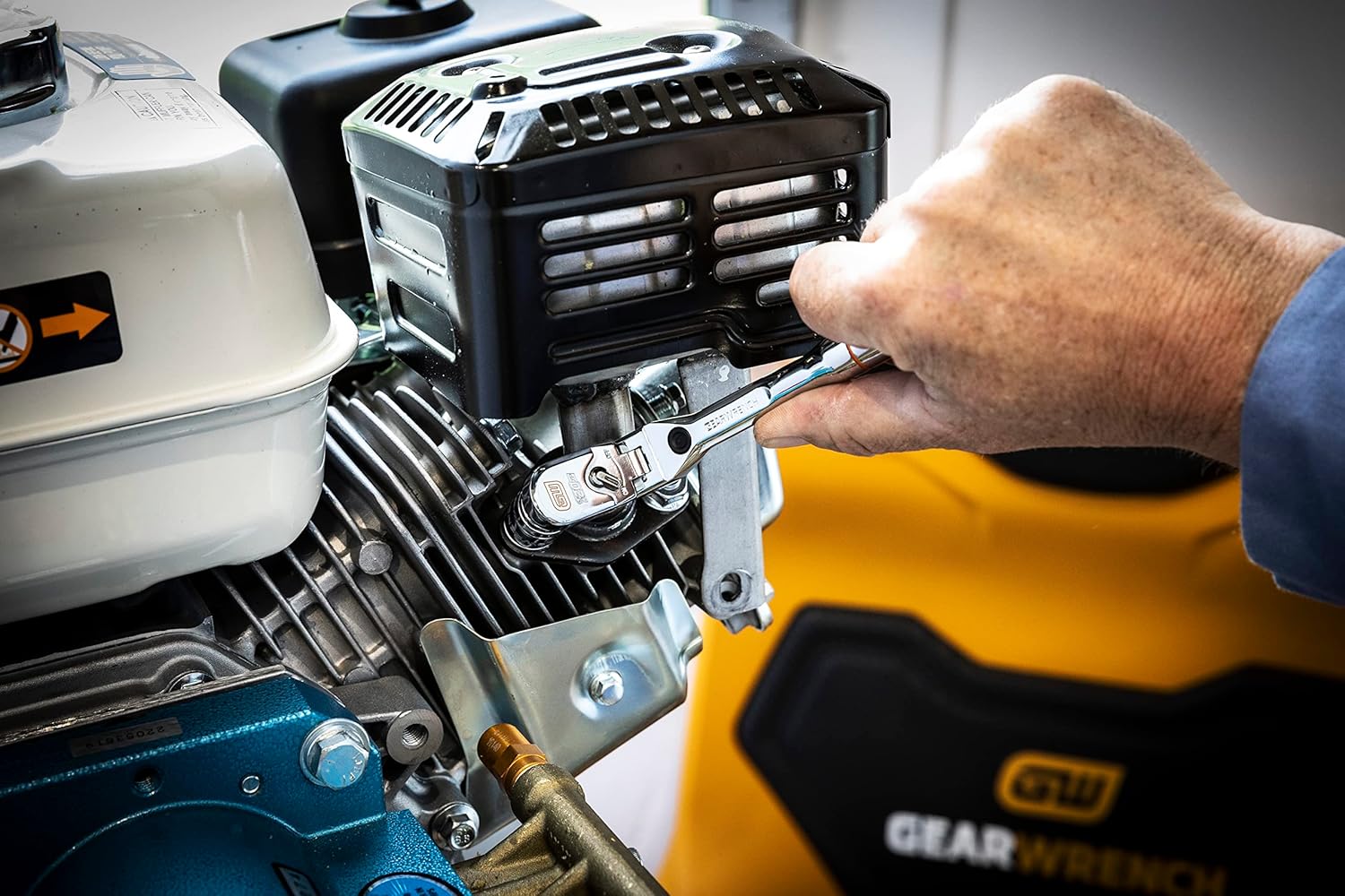 Gearwrench 120XP flex head ratchet in use on small engine with GearWrench branding visible