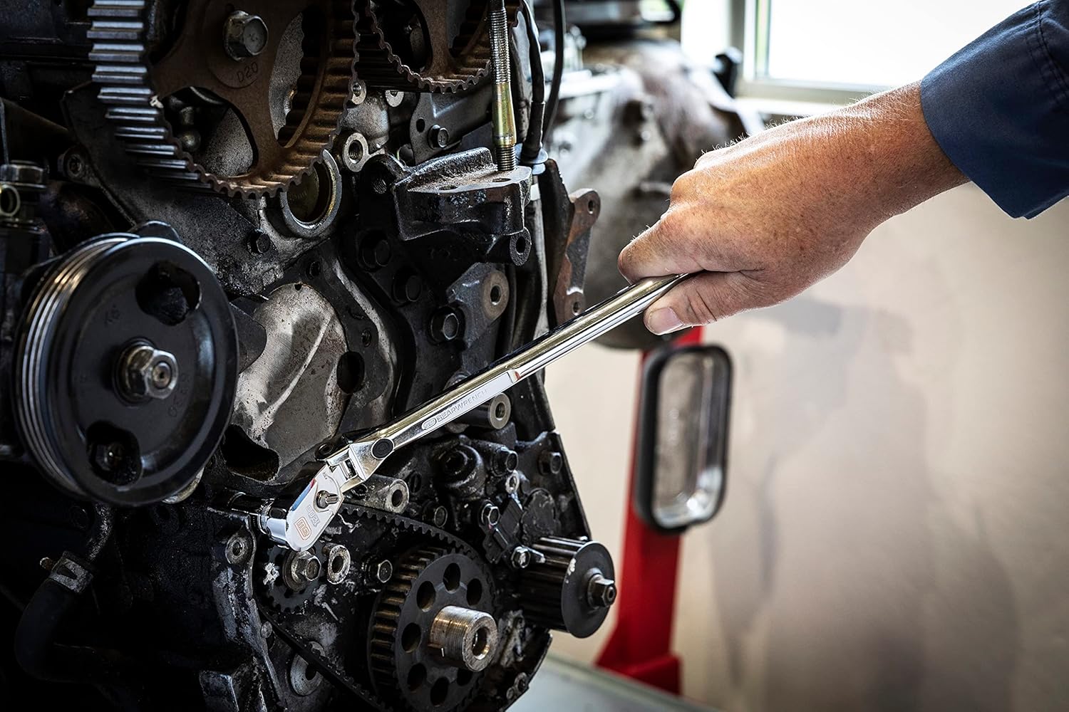 Gearwrench 120XP flex head ratchet in use on vehicle engine block