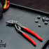Knipex Cobra ES 87 51 250 extra-slim water pump pliers on workbench with hex nuts