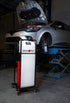 CTA Tools 8488 Brake-Pro Electric Pressure Brake Bleeder in use in automotive shop next to lifted vehicle