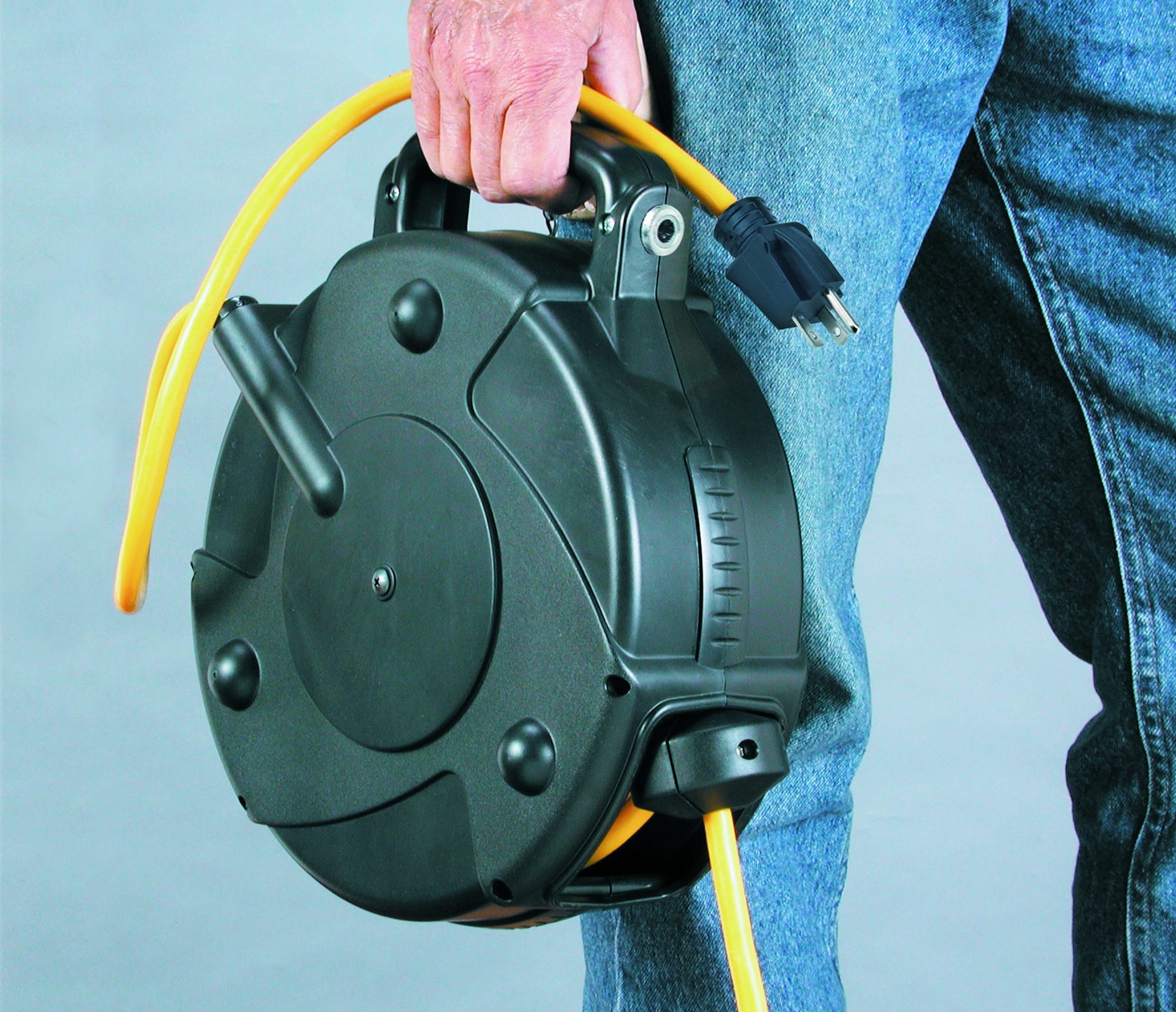 Alert Stamping 8665TFQ Retractable Cord Reel being carried by handle side profile view