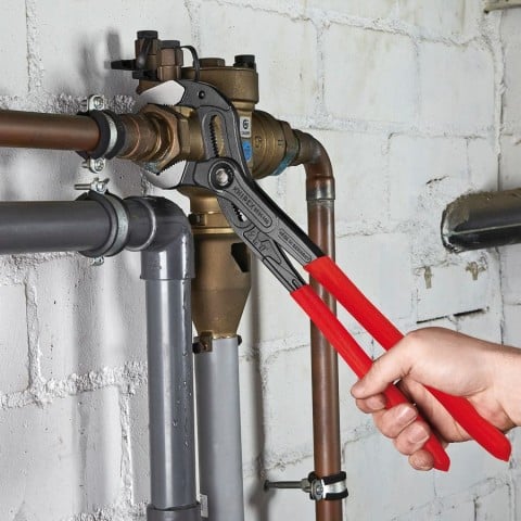 Knipex Cobra XL Water Pump Pliers in use gripping pipe fittings