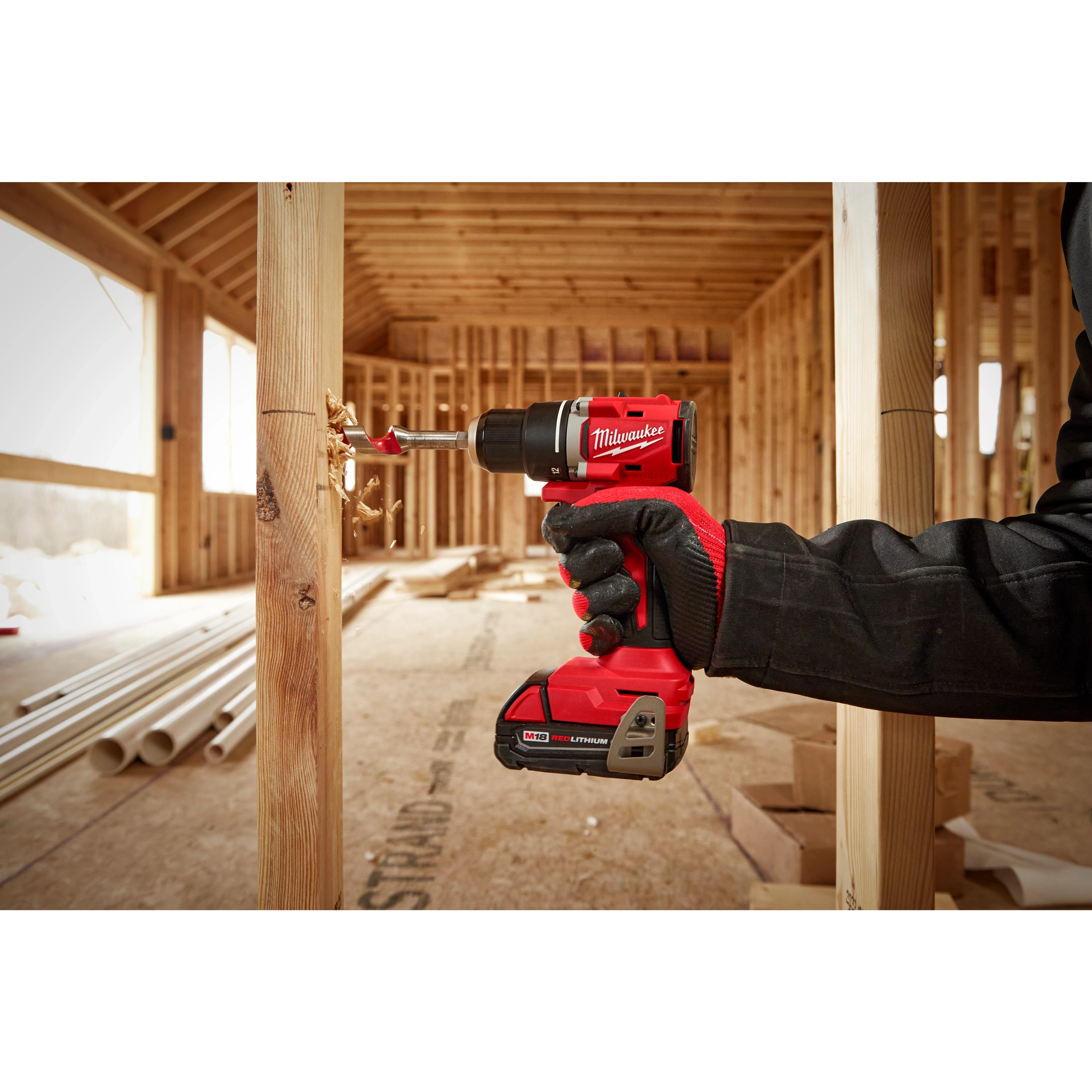 Milwaukee Tool 3601-20 M18 Compact Brushless Drill/Driver in use drilling through wood framing
