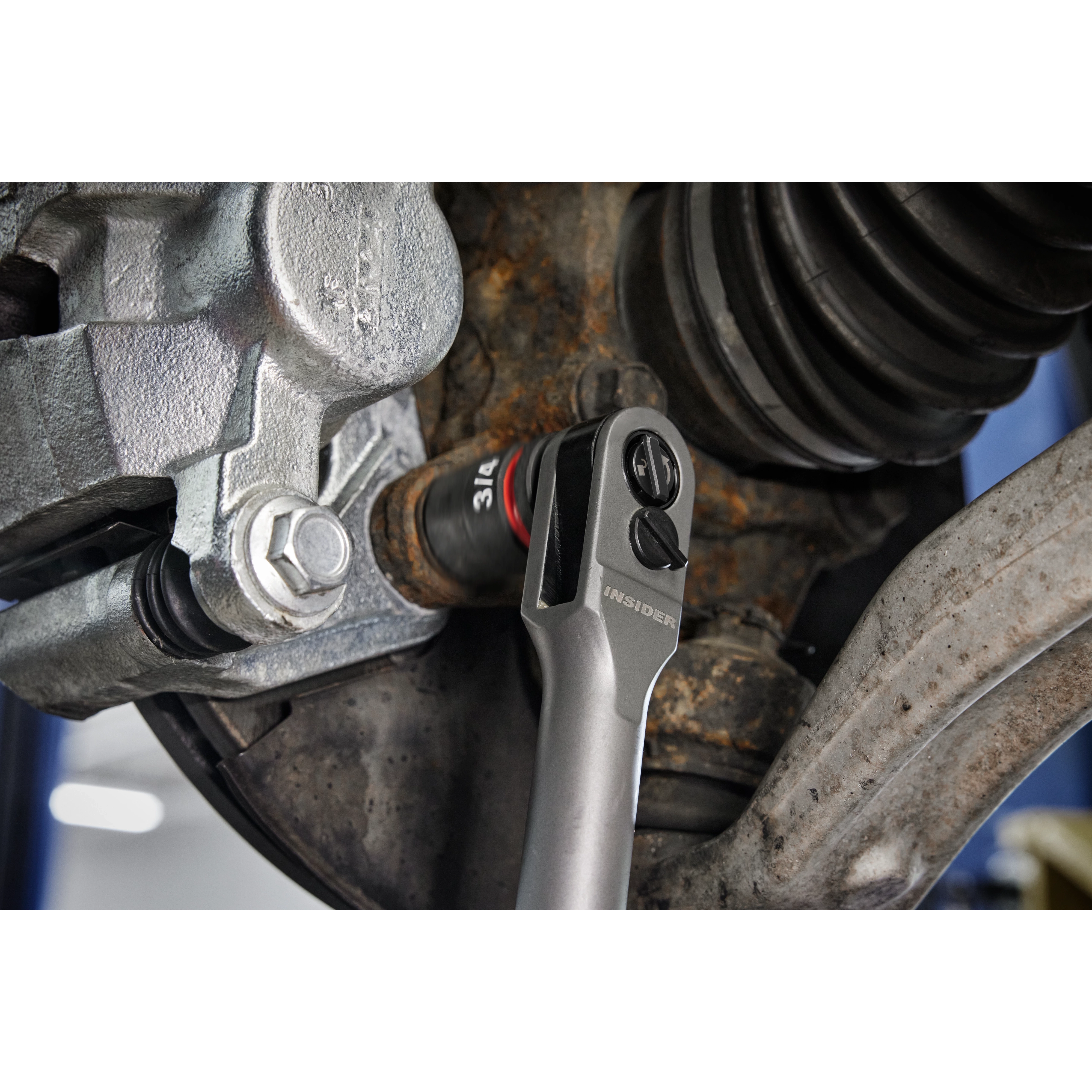 Milwaukee Tool INSIDER Box Ratchet in use on automotive brake assembly