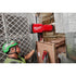 Worker using Milwaukee M18 Chain Hoist and wireless remote to lift HVAC equipment in tight space