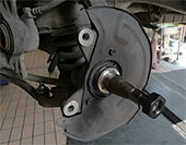 9 Circle 9CL-91300 CV Joint Rethreading Kit die being used on an axle spindle