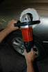 ATD Tools ATD-10511 7" Polisher with Soft Start in use polishing a car wheel well area