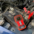 ATD Tools ATD-5494 Battery Analyzer connected to a car battery under the hood in an action shot