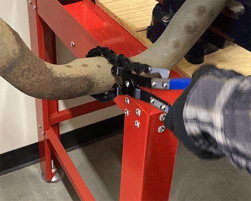 ATD Tools ATD-5721 Exhaust Pipe Cutter Pliers in use cutting an exhaust pipe