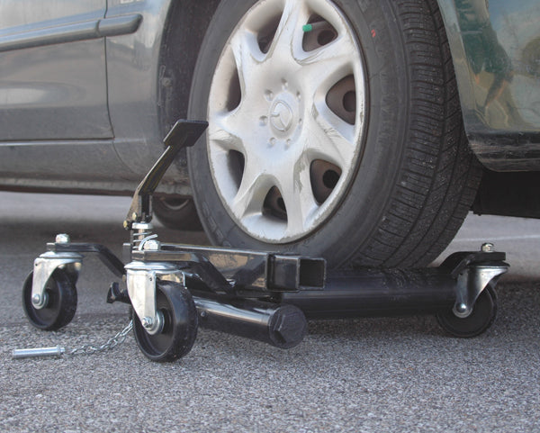 ATD Tools 7465 Hydraulic Vehicle Positioning Jack positioned under car tire - side view