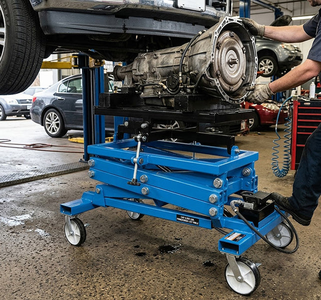 ATD Tools ATD-7478 2,500 Lbs. Powertrain Lifting Table - In Use Supporting Transmission in Auto Shop