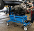 ATD Tools ATD-7478 2,500 Lbs. Powertrain Lifting Table - In Use Supporting Transmission in Auto Shop