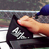 Access Tools AW Air Wedge being inserted at vehicle door frame in use