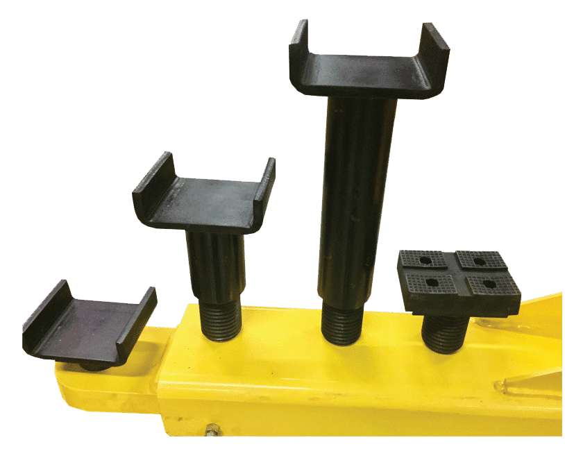 Close-up of screw-in saddle adapters with varying pad heights for the Coats 2-post lift