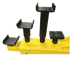 Close-up of screw-in saddle adapters with varying pad heights for the Coats 2-post lift