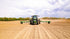 Agricultural tractor operating in field, representing heavy duty tire service application
